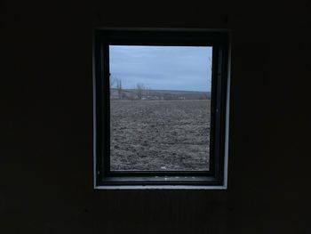 Landscape seen through window of building