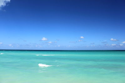 Scenic view of sea against blue sky