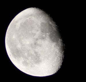 Low angle view of moon against sky at night