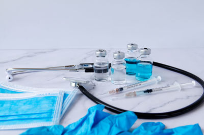 Close-up of blue container on table