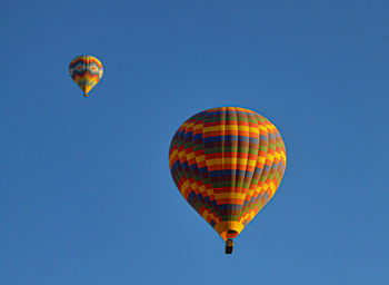 Low angle view of hot air balloons against sky