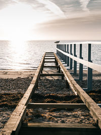 Pier over sea against sky