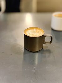 Close-up of coffee cup on table