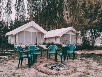 Chairs and tables on field