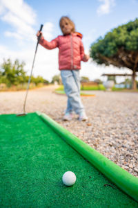 Low section of man playing golf
