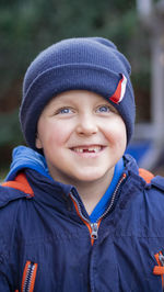 Portrait of young woman standing outdoors