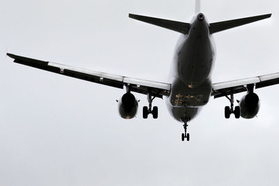 Low angle view of airplane flying in sky