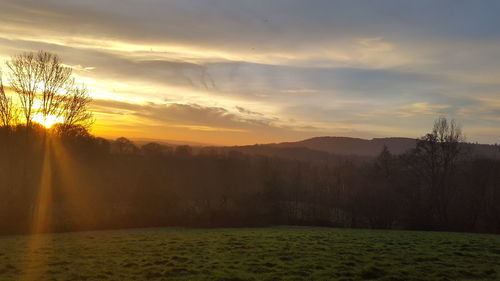 Scenic view of landscape against sky during sunset