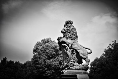 Low angle view of statue against sky