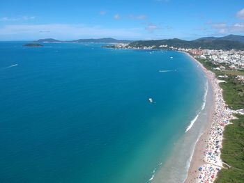 High angle view of sea against blue sky