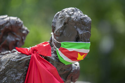 Close-up of statue against rock