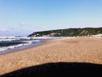 Scenic view of beach against clear sky