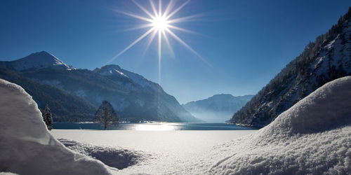 Scenic view of snowcapped mountains against sky