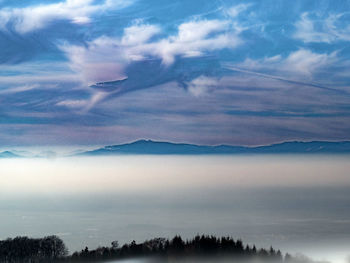 Scenic view of mountains against sky at sunset