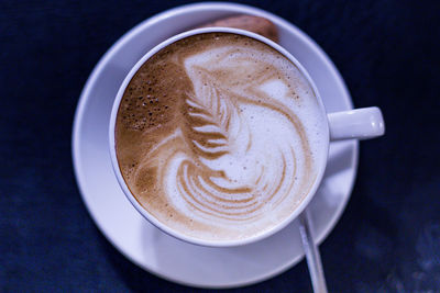 High angle view of cappuccino on table