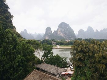 Scenic view of mountains against cloudy sky