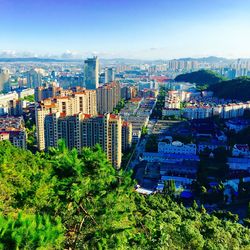 High angle shot of cityscape against clear blue sky