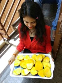 High angle view of woman holding food