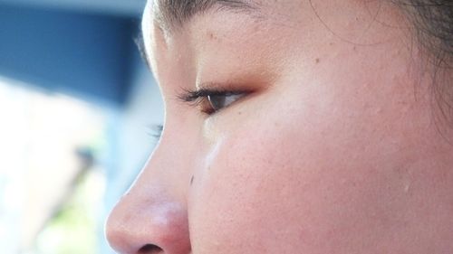 Close-up portrait of a girl looking away