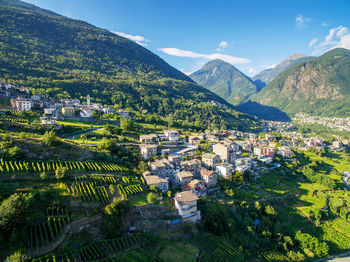 High angle view of townscape and mountains against sky