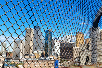 Full frame shot of chainlink fence against building