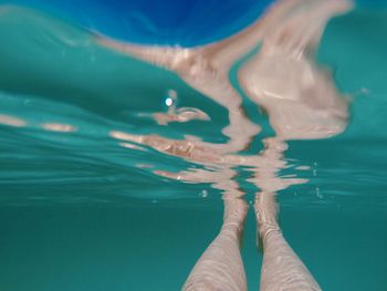 Low section of woman in swimming pool