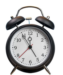 Close-up of clock tower against white background