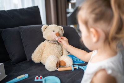 Girl with teddy bear