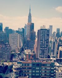 Modern buildings in city against sky