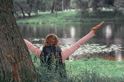 Young woman practicing yoga in the park. concept of mental health, wellness.