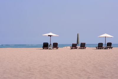 Lifeguard hut on beach against clear sky