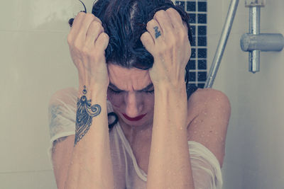Portrait of woman under the shower