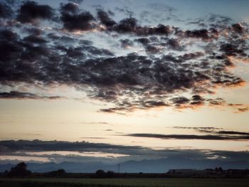 Scenic view of field against sky during sunset