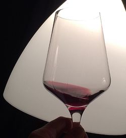 Close-up of beer glass against black background