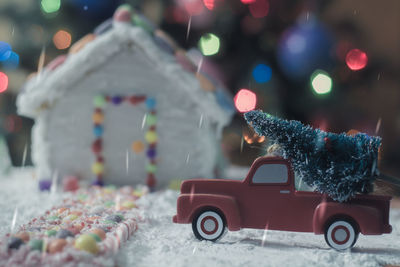 Toy car on tree during winter