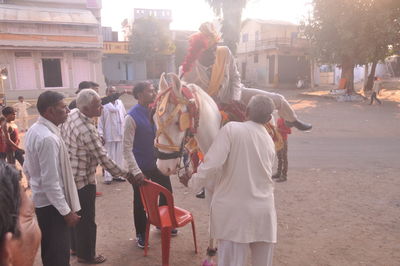 People standing on street in city