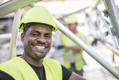 Portrait of happy worker at construction site