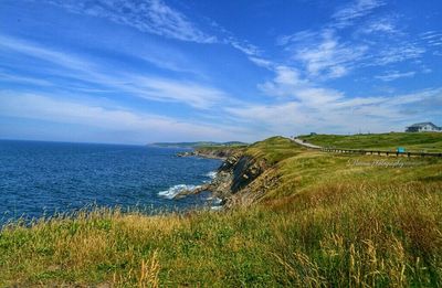 Scenic view of sea against cloudy sky