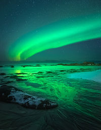 Scenic view of snow against sky at night