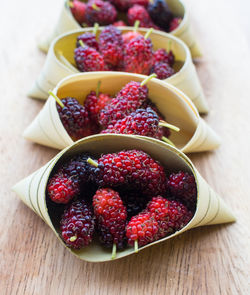 High angle view of strawberries in bowl on table