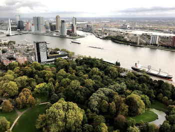 High angle view of river and cityscape against sky