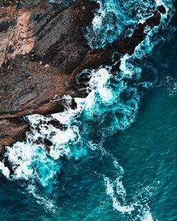 High angle view of rocks in sea