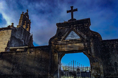 Low angle view of built structure against blue sky