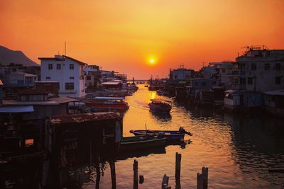 Boats moored at harbor