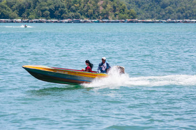 Men on boat in sea