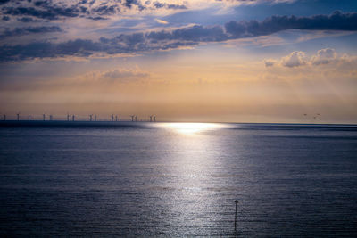 Scenic view of sea against sky during sunrise 