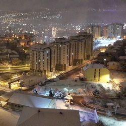 High angle view of illuminated cityscape against sky