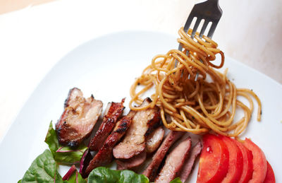 Close-up of served food in plate