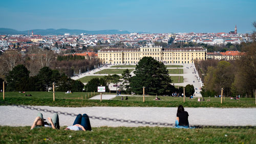 People in city against buildings