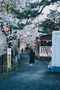 View of road sign on street in city